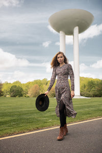 Printed maxi dress by Profile NYC featuring a flowing silhouette and vibrant floral pattern, perfect for casual or summer wear.