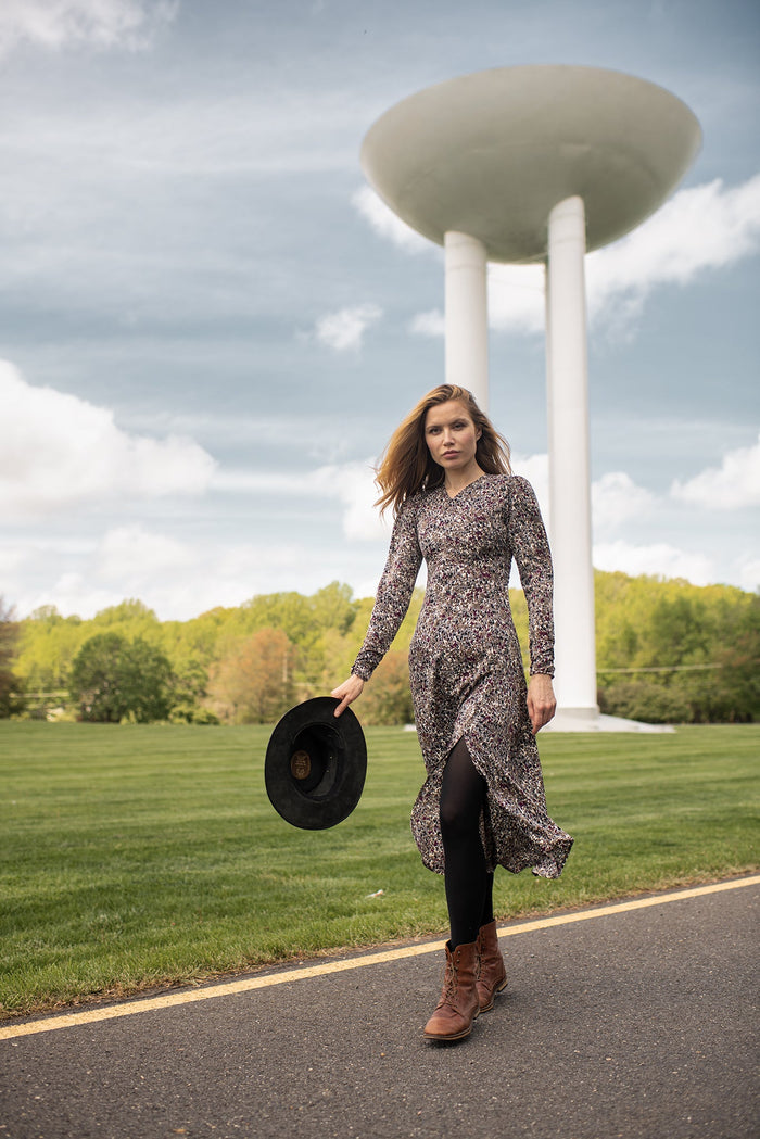 Printed maxi dress by Profile NYC featuring a flowing silhouette and vibrant floral pattern, perfect for casual or summer wear.