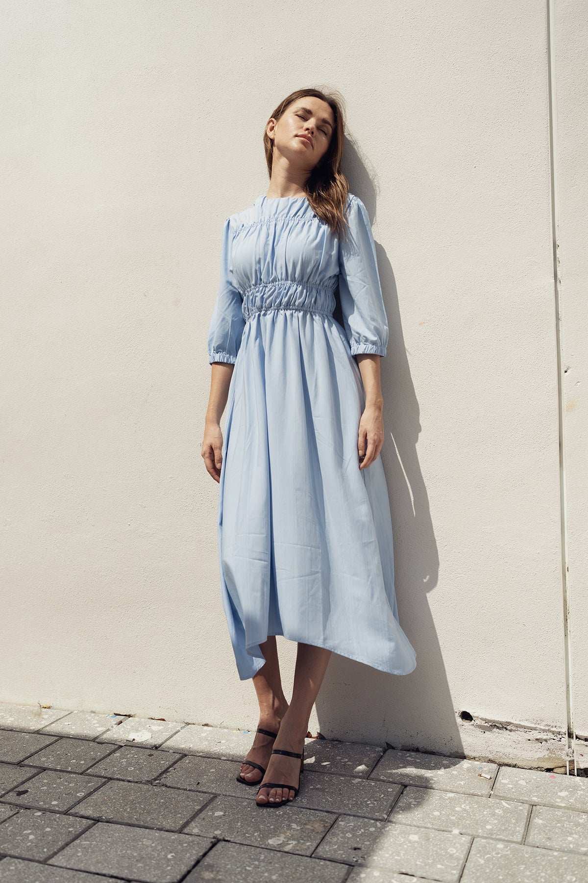 Sky smocking dress by Profile NYC featuring a stylish, fitted dress with intricate smocking details and a flattering silhouette.