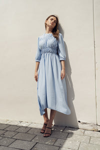 Sky smocking dress by Profile NYC featuring a stylish, fitted dress with intricate smocking details and a flattering silhouette.