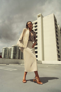 Light blue Profile NYC stretch summer blazer jacket with a tailored fit and classic lapel, displayed on a hanger.