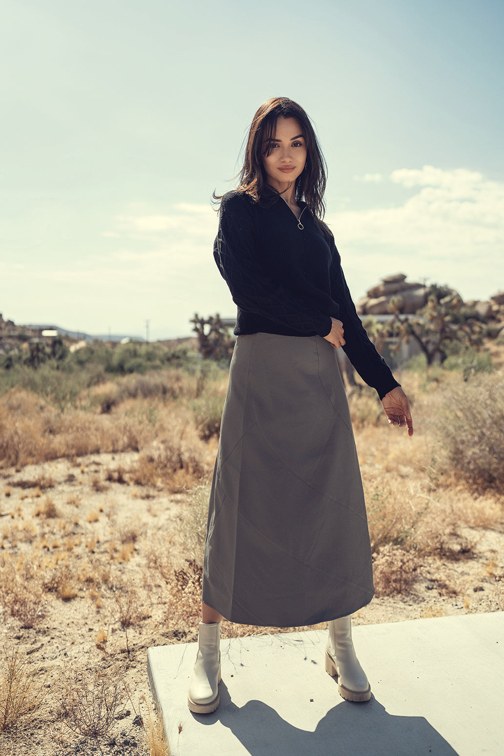 Wool seam skirt by Profile NYC featuring a fitted silhouette and seam details, styled in neutral tones.
