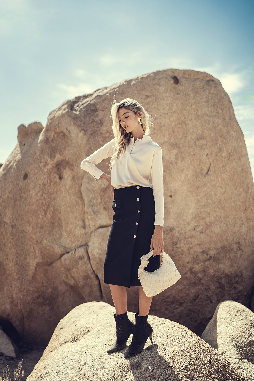 Wool button skirt by Profile NYC featuring a classic design with button details and a tailored fit.