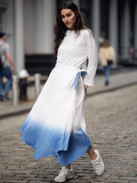 Linen ombre wrap skirt by profile-nyc featuring a flowing design and gradient color transition, styled with a fitted waist.
