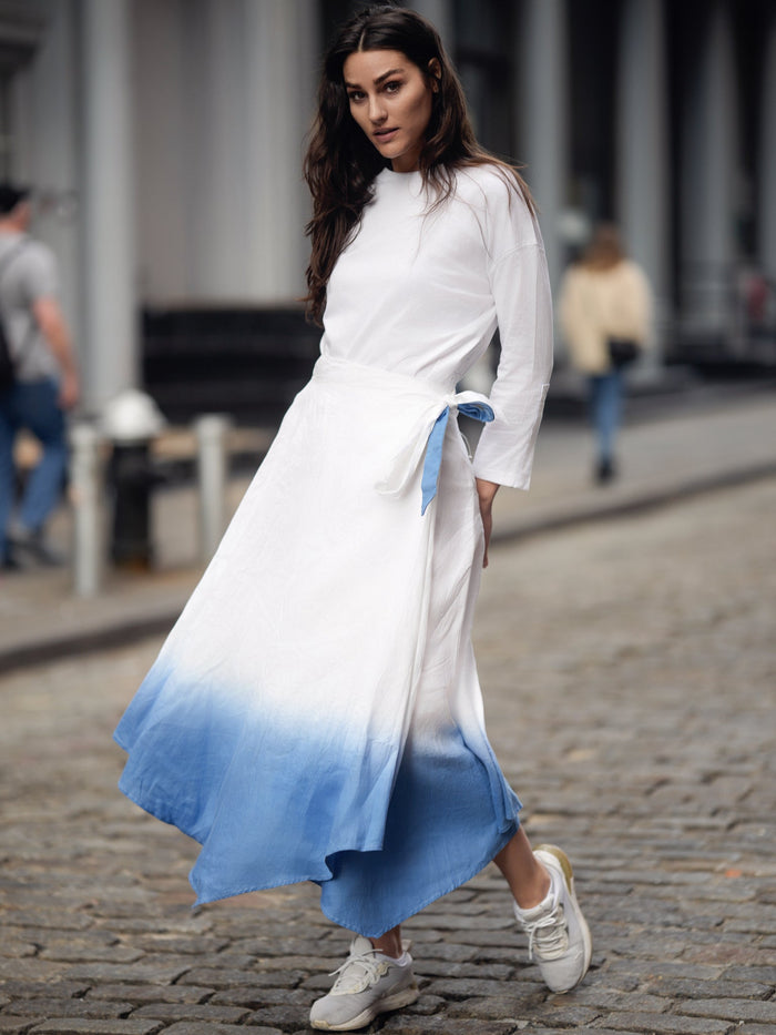 Linen ombre wrap skirt by profile-nyc featuring a flowing design and gradient color transition, styled with a fitted waist.