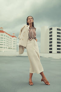 Colorful stretch denim skirt from Profile NYC, showing a fitted design with vibrant fabric and stylish details.