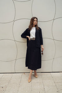 Black Lina belted skirt by Profile NYC, showcasing a stylish high-waist design with a matching belt and smooth fabric.