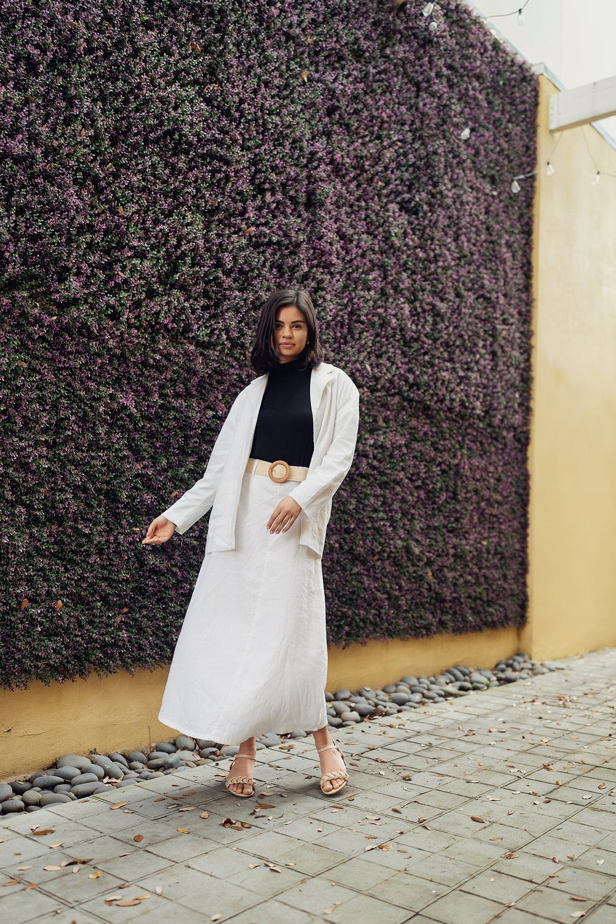 Black Lina belted skirt by Profile NYC, shown with a high waist and tailored fit, featuring a stylish belt detail.