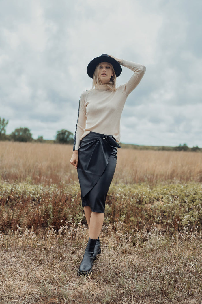 Black straight leather skirt with front buckle detail, stylish and fitted, by Profile NYC.