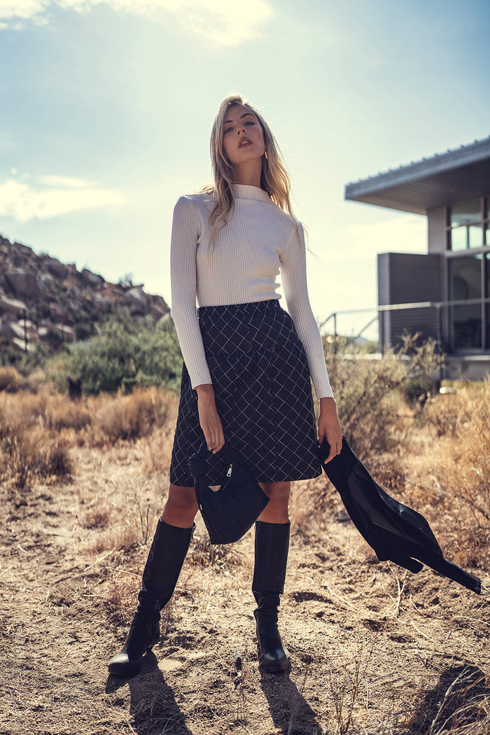 Quilted skirt by Profile NYC, stylish and textured with a quilted pattern, perfect for casual or chic outfits.