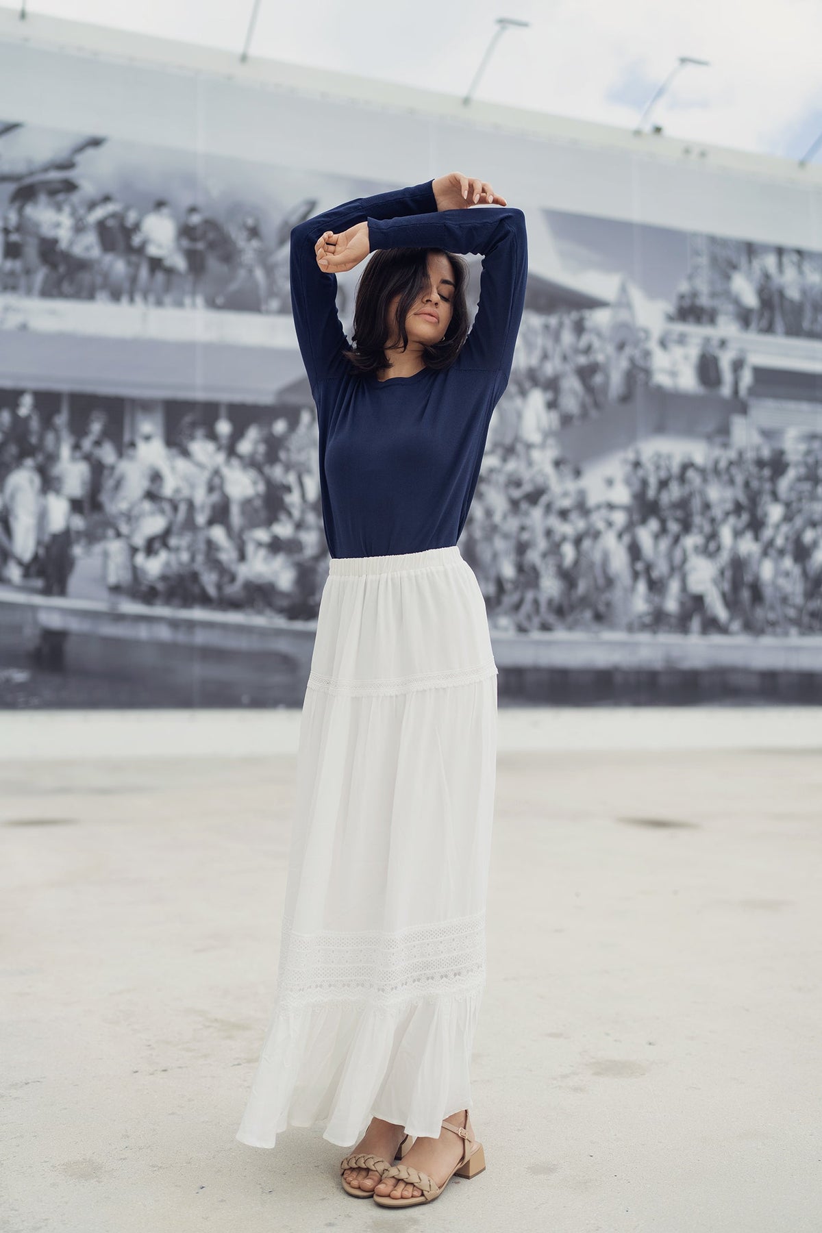 White eyelet skirt by Profile NYC, showing detailed fabric with eyelet pattern, casual style perfect for warm weather.
