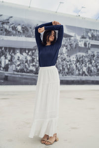 White eyelet skirt by Profile NYC, showing detailed fabric with eyelet pattern, casual style perfect for warm weather.