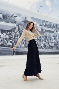 White eyelet skirt from Profile NYC, featuring a lightweight, feminine design with eyelet detailing and a flattering fit.
