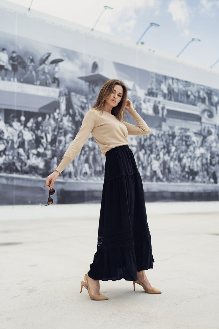 White eyelet skirt from Profile NYC, featuring a lightweight, feminine design with eyelet detailing and a flattering fit.