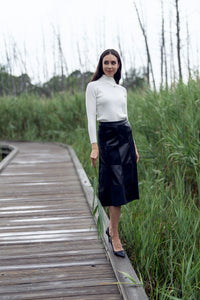 Black leather suede skirt by Profile NYC featuring a stylish, fitted design and a smooth, matte finish.