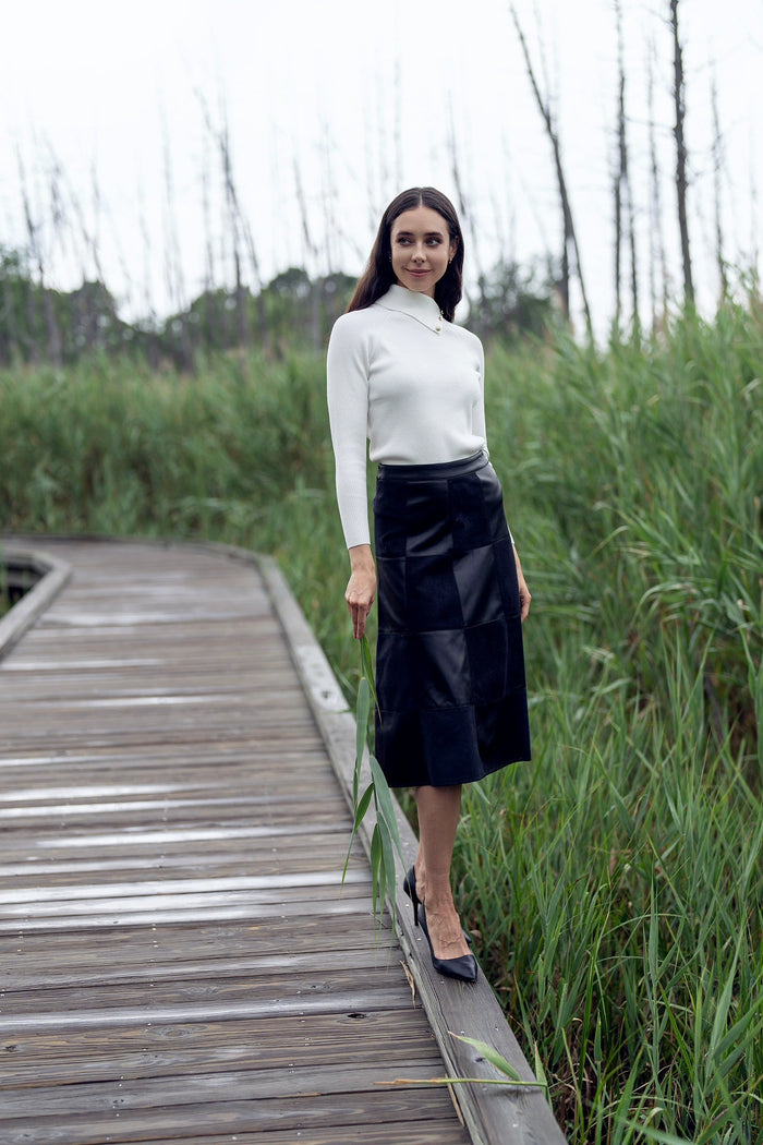 Black leather suede skirt by Profile NYC featuring a stylish, fitted design and a smooth, matte finish.