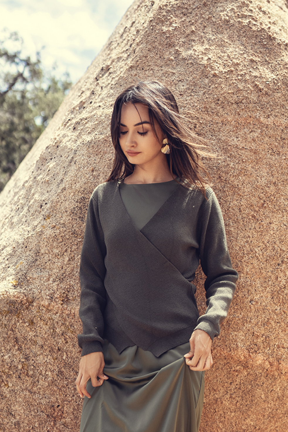 Profile NYC faux wrap sweater featuring a stylish, cozy design with a flattering fit and soft fabric in a versatile color.
