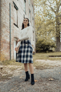 Cream-colored balloon sleeve sweater by profile-nyc, featuring a cozy knit fabric and stylish oversized balloon sleeves.