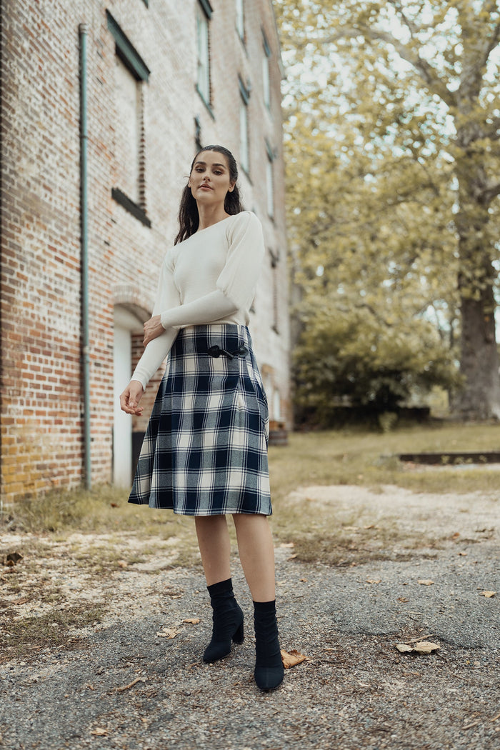 Cream-colored balloon sleeve sweater by profile-nyc, featuring a cozy knit fabric and stylish oversized balloon sleeves.