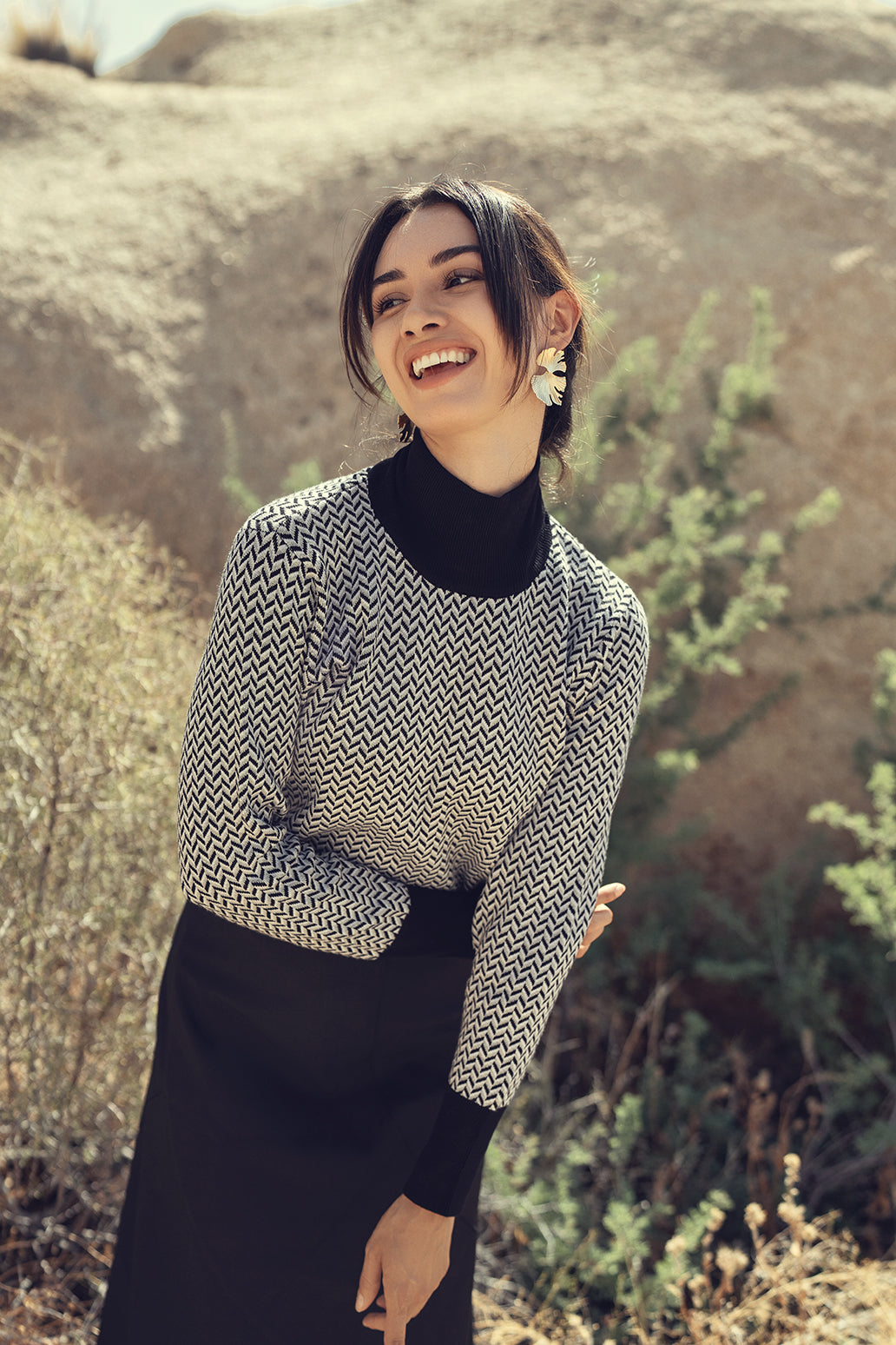 Black and white design sweater by Profile NYC, featuring a stylish pattern and comfortable fit.