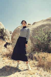 Black and white design sweater by Profile NYC, featuring a stylish knit pattern and comfortable fit.