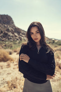 Cable knit zipper sweater by Profile NYC featuring a cozy, textured knit design and a front zipper closure.