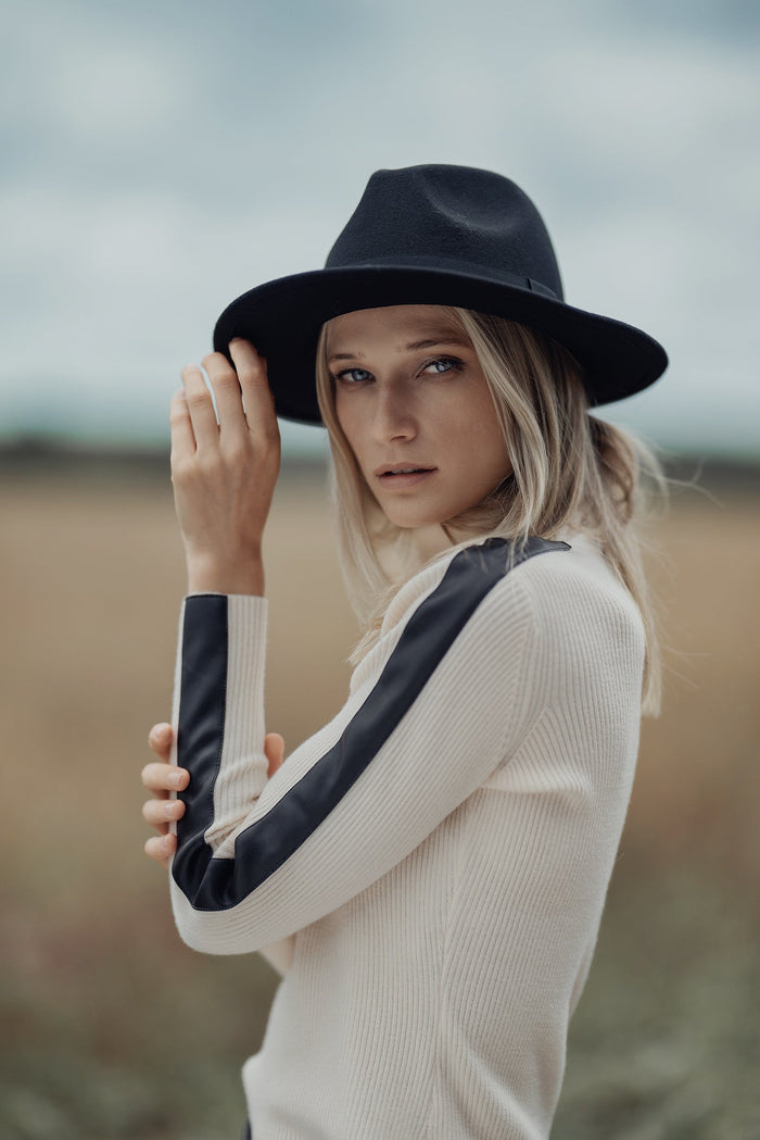 Profile NYC turtleneck sweater with leather detail, showcasing a cozy knit with stylish leather accents on the collar and sleeves.