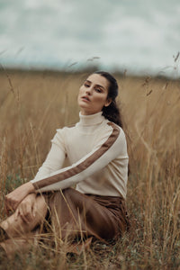 Profile NYC turtleneck sweater with leather detail, featuring a cozy knit fabric and stylish leather accents.
