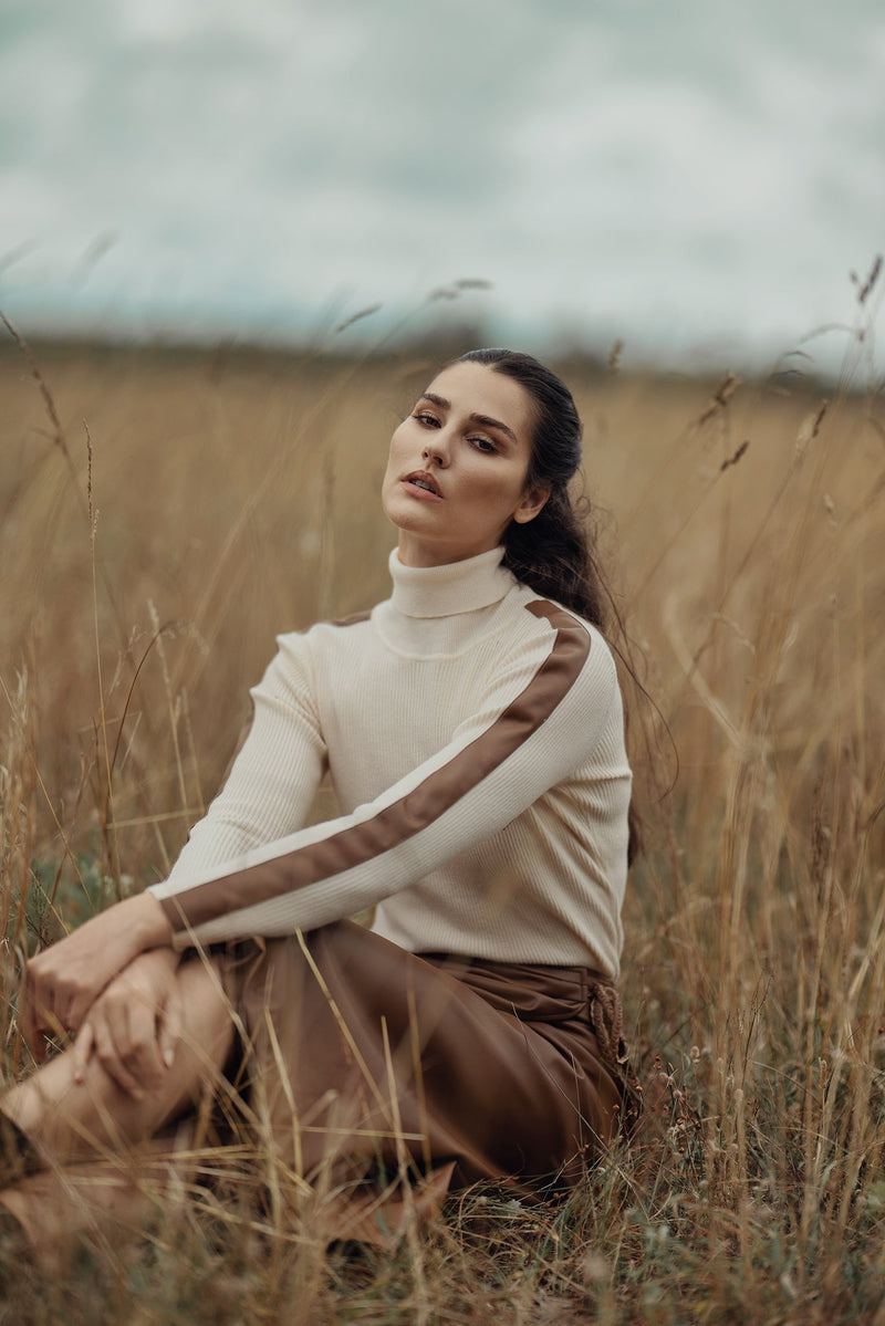 Profile NYC turtleneck sweater with leather detail, featuring a cozy knit fabric and stylish leather accents.