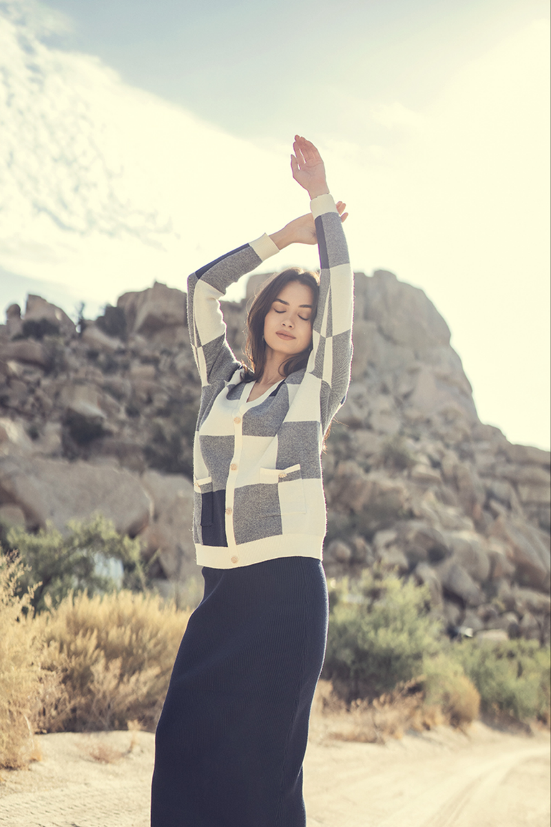 Oversized checked faux cardigan sweater by Profile NYC, featuring a cozy, stylish plaid design in neutral tones.