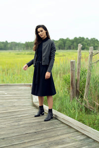 Profile NYC wool and leather jacket displayed on a hanger, showcasing its classic design and high-quality materials.