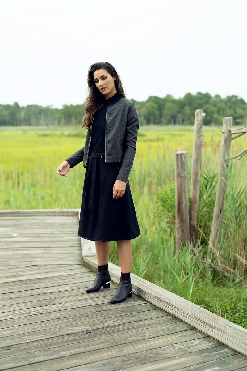 Profile NYC wool and leather jacket displayed on a hanger, showcasing its classic design and high-quality materials.