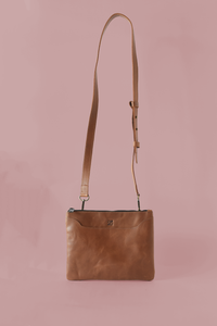 Brown Purse & Clutch simple crossbody bag with adjustable strap and sleek design, ideal for everyday use.