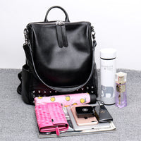 Black women's Rirati leather backpack with rivets, stylish Korean fashion backpack featuring a spacious design and personality details.