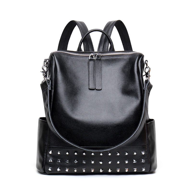 Black women's Rirati leather backpack with rivet accents, stylish Korean fashion design, spacious and durable for everyday use.