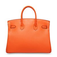 White women's leather handbag by Rirati featuring a strapless design and genuine cowhide leather material.