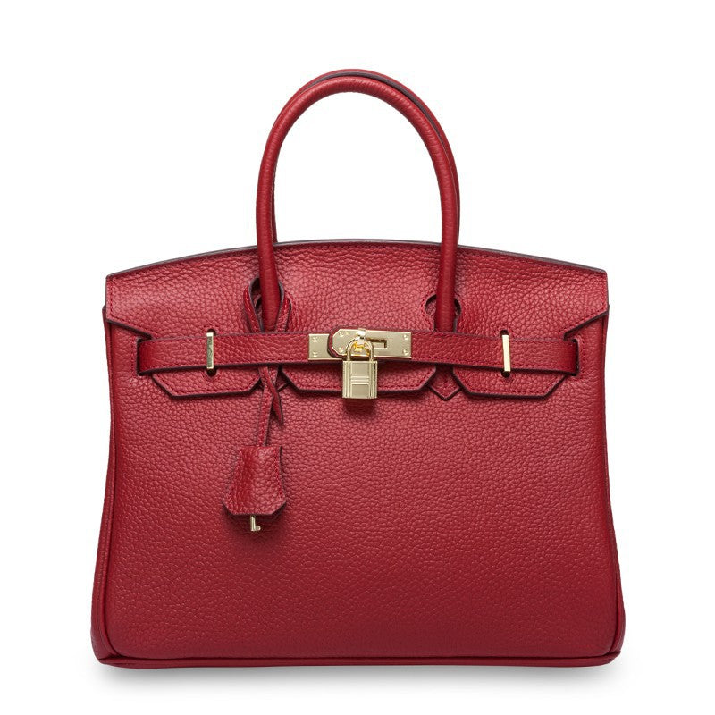 White women's leather handbag by Rirati, made from genuine cowhide, featuring a portable design with a 35cm strap.