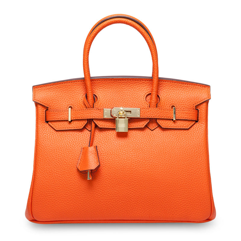 White women's leather handbag by Rirati, made from genuine cowhide, featuring a portable design and 35cm strap.
