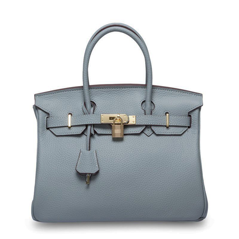 White women's Rirati handbag made of genuine cowhide leather, portable with a 35cm strap and stylish first layer leather design.