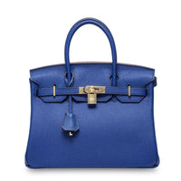 White Rirati women's handbag made from genuine cowhide leather, featuring a portable design and 35cm strapless style.