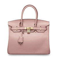 White women's leather handbag by Rirati, made from genuine cowhide, featuring a portable, strapless design.