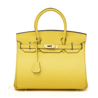 White women's handbag by Rirati made of genuine cowhide leather, featuring a portable design and 35cm strapless style.