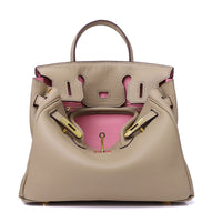 White women's leather handbag by Rirati, made from genuine cowhide, featuring a portable design and 35cm strap.