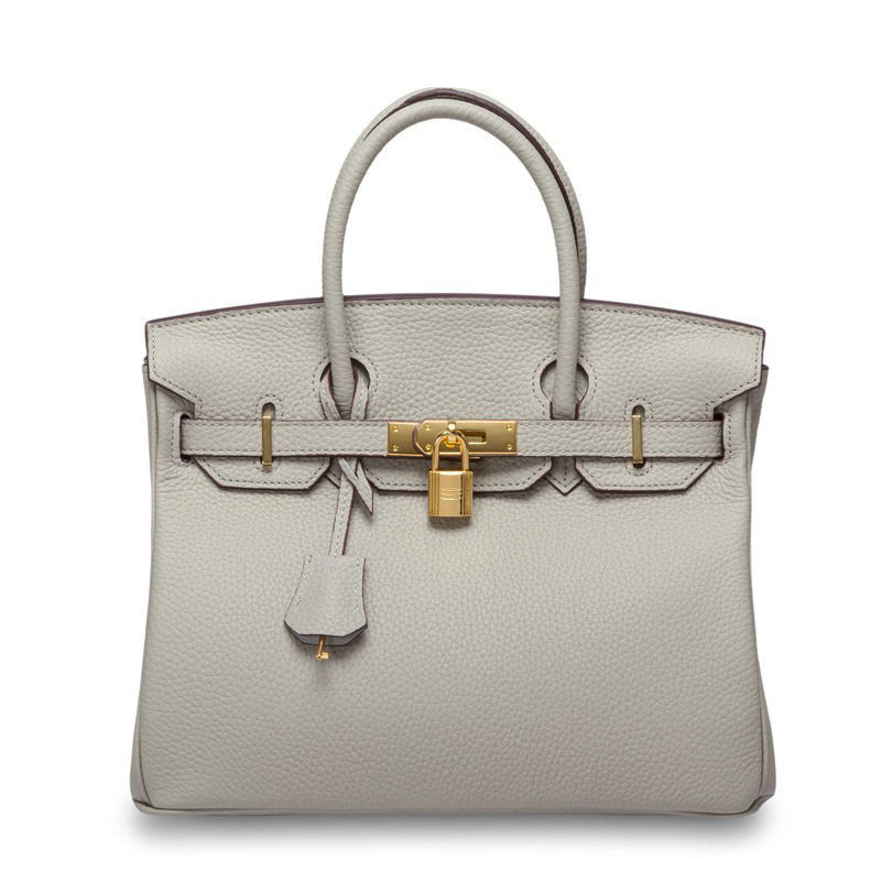 White women's leather handbag by Rirati with 35cm strap, crafted from genuine cowhide, portable and stylish for everyday use.