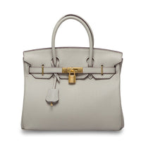 White women's leather handbag by Rirati with 35cm strap, crafted from genuine cowhide, portable and stylish for everyday use.