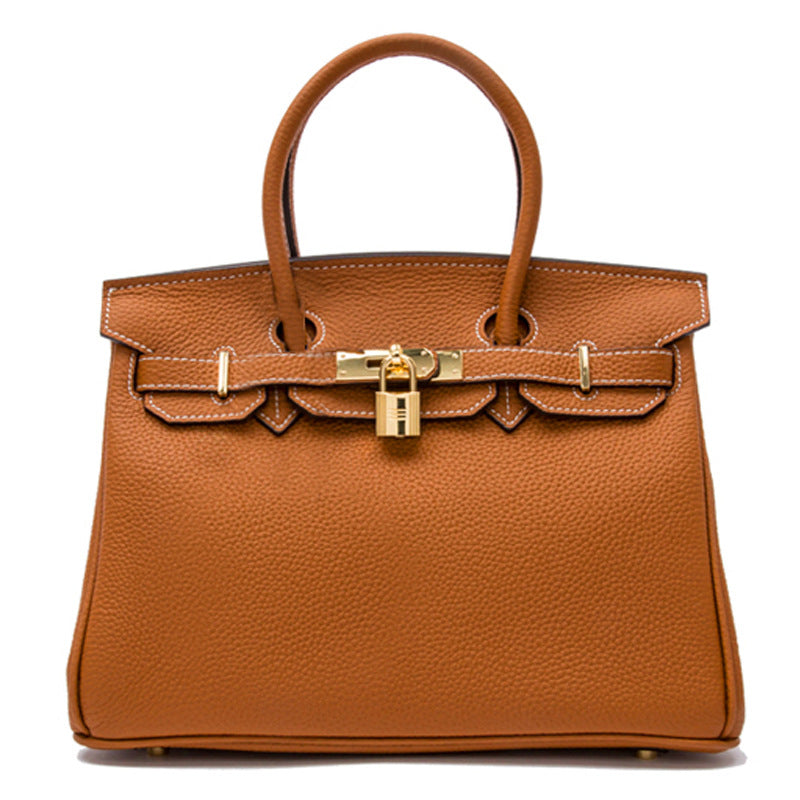 White women's leather handbag by Rirati, made from genuine cowhide, featuring a portable design and 35cm strap.