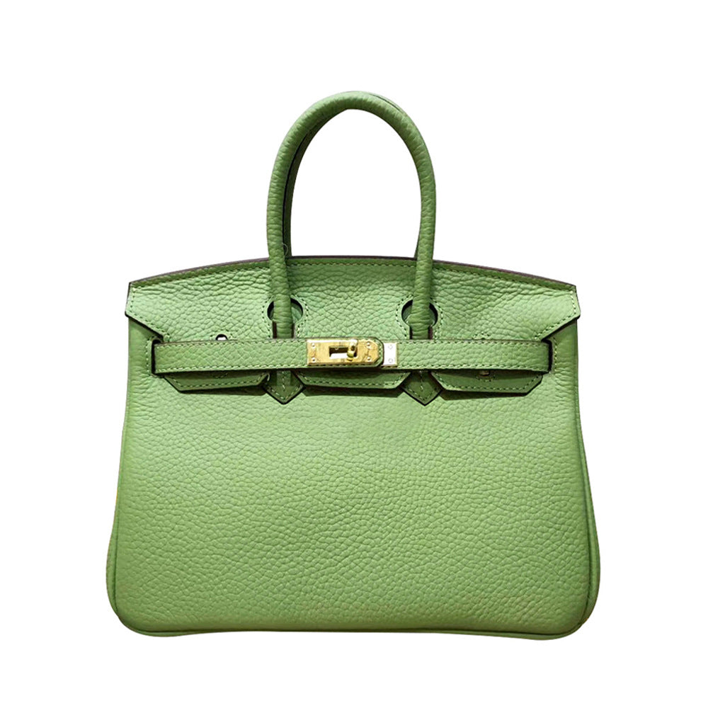 White women's leather handbag by Rirati, made from genuine cowhide, featuring a portable design and a 35cm strap.