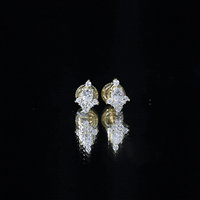 Rosec Jewels certified moissanite stud earrings in yellow gold-plated silver, showcasing sparkling gemstones on sleek, elegant earrings.