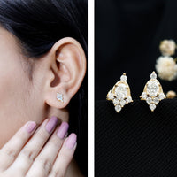 Rosec Jewels certified moissanite stud earrings in yellow gold-plated silver, featuring sparkling gemstone and classic earring design