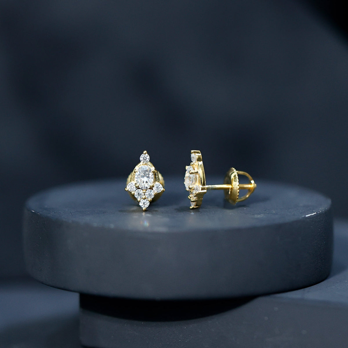 Rosec Jewels certified moissanite stud earrings in yellow gold plated silver, featuring sparkling gemstone and classic design.